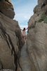 Nudist Girl Climbing on Tiny Narrow Canyon